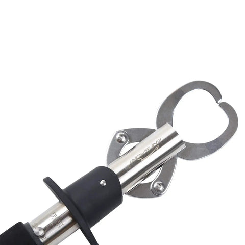 Close-up of stainless steel fish lip gripper with weight scale, showing quick release jaws and non-slip EVA handle.
