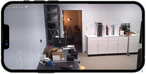 Keep Tabs On Your Space With This Snap 4K Wireless Smoke Detector Camera Hardwired To 120V AC For Ceiling Install showing live feed on smartphone.