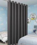 Extra Wide Room Divider Curtain 96X150 Inch For Total Light Blocking And No Sweat Rod Prep With Heavy Duty Metal Grommets in dark grey.