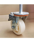 Heavy Duty Nylon Swivel Casters With Locking Brake, 4 Inch Threaded Stem Wheels, close-up view of white wheel and metal structure.