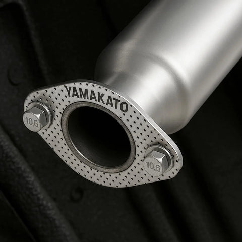 Close-up of YAMAKATO 62mm 2-bolt high-temp exhaust gasket flange with perforated metal; two bolts visible.