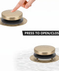 Top Shelf Champagne Bronze Bathtub Drain Stopper With Tip Toe Overflow Faceplate and Warm Brushed Gold Finish for Classy Bathroom Refresh Quick Swap and Done, showing finger pressing.