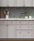 Modern kitchen with Square Kitchen Cabinet Knobs 10 Pack 1-3/16 Inch Matte Black Handles on white cabinets.