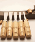 Pro Grade Wood Carving Chisels And Knife Set For Diyers And Beginners Basic Wood Cutting Projects And Detailed Woodworking Hand Tools 13mm Size With Durable Wood Handle, chisels with wooden handles displayed on a table.