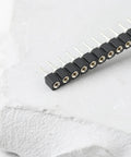 10 Pcs 40 Pin 2.54mm Pitch PCB Connector Socket, Single Row Headers For PCBs on white textured background