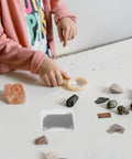 Child using 5 Piece Magnetic Field Demonstrator Kit With Iron Filings For Physics Classrooms Hands On Adjustable Magnetic Field Box