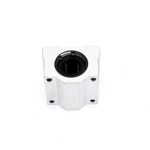 Front view of white SCS16UU linear bearing block with 16 mm bore and mounting holes.
