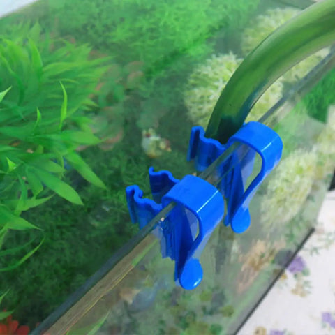 Adjustable Hose Clip Holder For Aquariums Buckets And Tanks securing hose on aquarium rim, blue color