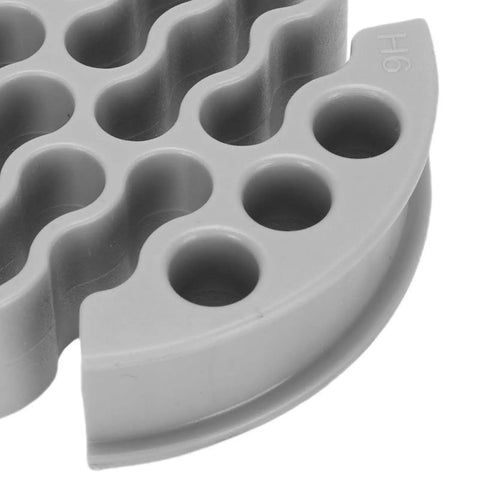 Close-up of a straight shooting wire comb for 30 network cables with a slick slip-through design, made of durable plastic.
