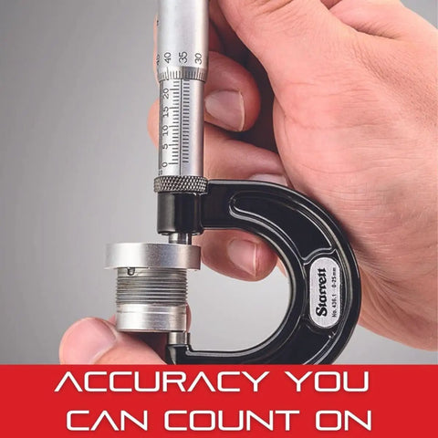 Hand holding Outside Micrometer With One Piece Spindle Satin Chrome Finish And Tapered Frame Quick And Easy Adjustment