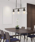Dining room with Three Light Farmhouse Kitchen Island Pendant Chandelier, 35.4 in Long, Black Finish With Seeded Bubble Glass
