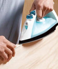 Iron applying Maple Wood Veneer Edge Banding Tape Seven Eighths Inch By Two Hundred Fifty Foot Roll With Pre Glued Iron On Adhesive Hot Melt Bond