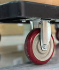 Heavy Duty 4 Inch Replacement Caster Wheels 4 Pack, Pre Assembled PVC Swivel Casters under a cart showcasing red polymer wheels.