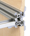 Built Tough Heavy Duty Aluminum Shelf Brackets set showing 202, 3030, 4040 corner fittings in use on wooden panel
