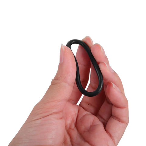 Must Have 10 Piece Rubber Sealing Ring Set For Pail Lids And Oil Buckets, Leakproof And Airtight Gasket Replacement For Farm And Job Site Use, Easy To Install Spare Part, Durable Rubber Seal Keeps Liquids Contained black rubber ring held by hand