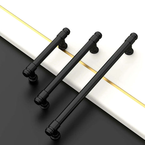 Score These Knockout Matte Black Cabinet Pulls And Drawer Handles For Updating Your Kitchen Or Bath Setup With Dependable Five Inch Center Spacing For Easy Install - 5-inch matte black drawer handles on a black surface.