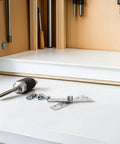 Built Tough Hidden Door Hinge Kit With Six Stainless Steel Pivot Hinges on a workbench, visible hardware tools and accessories included