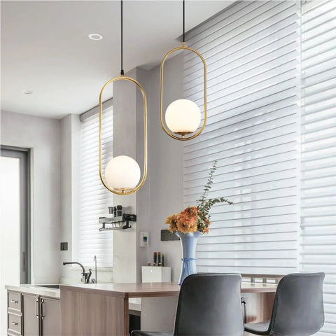 Modern One Light Globe Pendant With White Milk Glass Shade In Brushed Brass Finish For Kitchen Island Farmhouse Living Spaces Mid Century Style Ceiling Lighting Fixture above kitchen island in modern kitchen