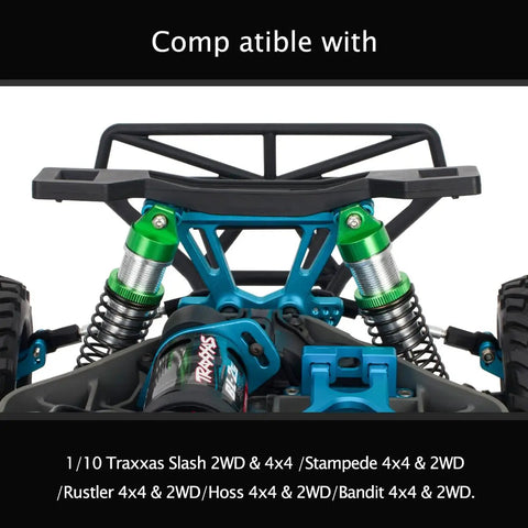 Close-up of aluminum front and rear shock absorbers for 1 to 10 Slash 4x4 2WD Rustler VXL Stampede RC car, green anodized.