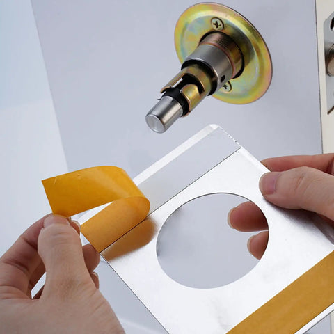 Applying adhesive on 2 Pack Stainless Steel Door Reinforcement Plates For Lever Locks And Door Bolts Backplates Rust Resistant and Weatherproof.