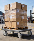 Nefish 5-inch heavy-duty caster wheels, 4-pack with brakes, on a metal platform cart carrying stacked cardboard boxes.