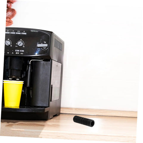 Black insulation sleeve for steam wand guard and rubber cover heat shield for coffee machines next to an espresso machine