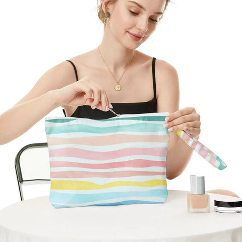 Woman holding Waterproof Wet Dry Bag Large Travel Organizer Zip Pouch for Swimsuits, Diapers, Toiletries and Makeup Hangable Handle Design