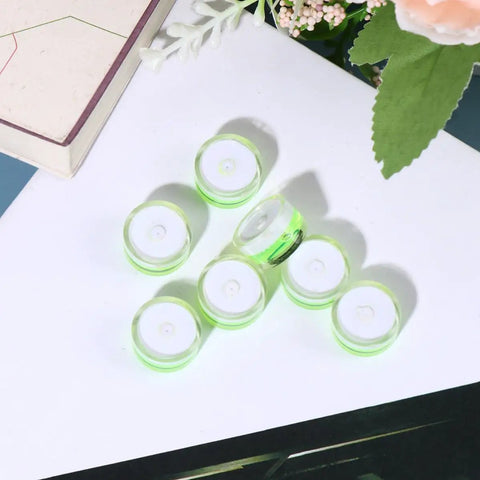 10 Pack Circular Bubble Spirit Levels Acrylic Round Bubble Level Set for Calibration and Quick Leveling on a white surface