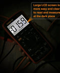 Ranging Digital Multimeter TRMS 6000 with large LCD screen displaying measurement, held in hand in a dimly lit area