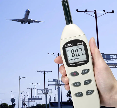 Person holding Must Have Pro Grade Digital Sound Level Meter For Worksites And Audio Installations 40 To 130 dB Range.