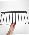Heavy Duty Wall Mounted Power Tool Holder With Rock Solid Steel Garage Storage Rack For Drills And Hand Tools showing a black steel rack with hand.