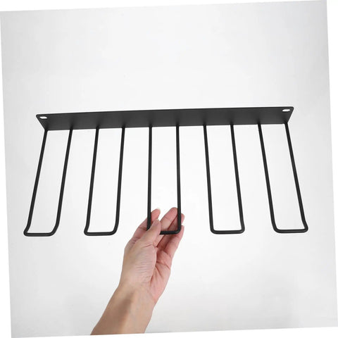 Heavy Duty Wall Mounted Power Tool Holder With Rock Solid Steel Garage Storage Rack For Drills And Hand Tools showing a black steel rack with hand.