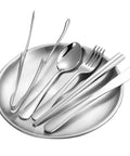 Outdoor Camping Mess Kit For Two With Stainless Steel Forks Spoons Knives Plates And Food Clip on a plate