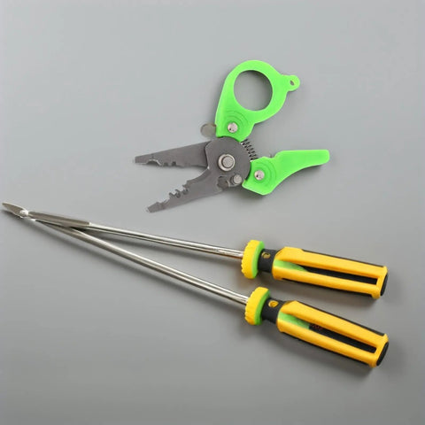 Heavy Duty Mini Wire Stripper And Cutter Pliers next to two sturdy yellow-handled screwdrivers on a gray background.