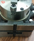 Heavy Duty 6 Inch Precision Indexing Spacer With Adjustable Chuck Rock Solid Worm Gear Rotary Base top view on wooden surface.