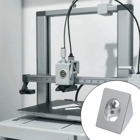 Close-up of a silver Two Way Triangle Corner Bracket For 2020 Aluminum Extrusion Frame, 3D printer in the background.