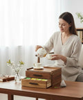 Woman using Wood Tea Bag Organizer With Gift Box Double Drawer Tea Box for tea accessories storage on countertop, acacia wood finish.