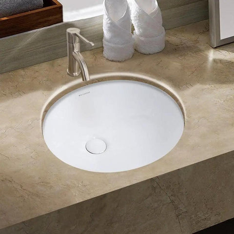 Isabella Plus 16 Inch Oval Undermount Basin With Overflow And Rear Center Drain White ceramic sink installed in countertop