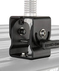 Versatile Roof Rack Mount Bracket For Antennas And Lights, 180-Degree Rotating, Easy Install, shown on heavy duty bar
