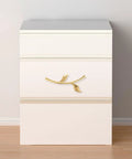 Gold bird-shaped ergonomic metal cabinet handle on white dresser, part of Ergonomic Metal Cabinet Handles And Drawer Pulls For Cabinets.