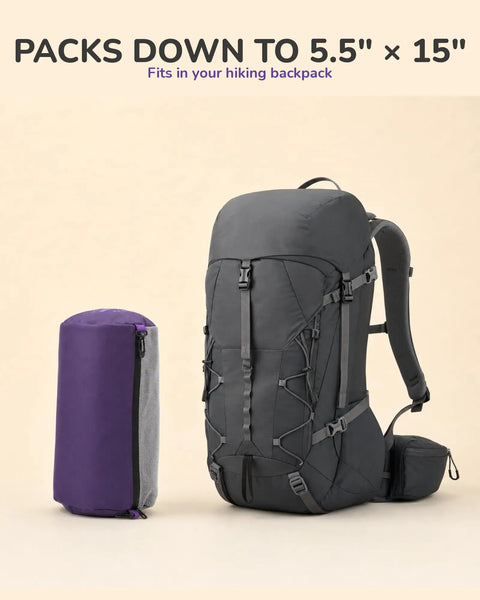 Capy Ultralight Camping Chair For Backpacking And Festivals, compactly packed in purple bag next to hiking backpack
