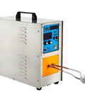Built Tough Heavy Hitter Induction Heater 15KW with control panel and water cooling outlet for metal melting tasks.