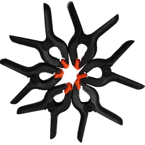 Circular arrangement of must have four inch spring clamps set for woodworking and photo studio backdrops durable plastic nylon clips.
