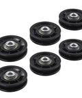 Six Piece Pulley Wheel Set For Home Gym And Cable Machines With Smooth Nylon Rollers And Steel Bearings In 70mm And 90mm Sizes, Quiet Durable Gear For Strength Training And Fitness Upgrades. Six black pulley wheels with steel bearings