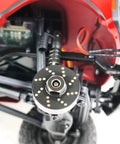 Close-up of Brass Wheel Weights Set 4 Pack 13g Each For 1 24 Scale RC Crawler on Axial SCX24 Model chassis, showing 7mm hub