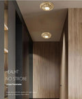 UWYTGF 6 Pack Led Can Lights Retrofit Recessed Lighting illuminating a modern hallway with brass fixtures.