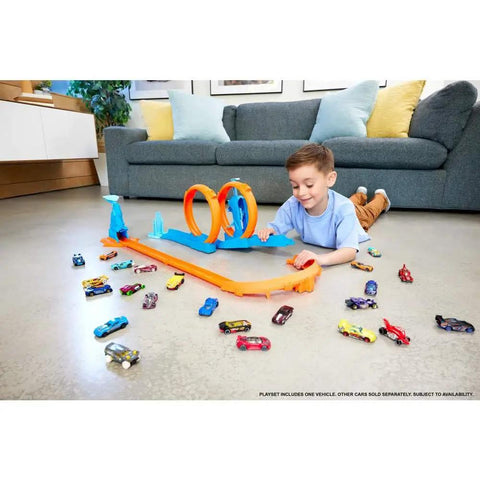 Child playing with Triple Loop Track Set For Kids With 1 To 64 Scale Vehicle Build Crazy Tracks With 3 Loops Speed Snap Tracks
