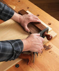 Pro Grade Shooting Board Jig For Hand Planes in use, 20 by 14 inch frame gripping wood for precise manual cuts.