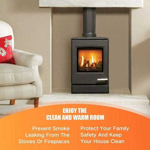 Wood-burning stove in a beige fireplace surround, black metal finish, with a white sofa nearby and an orange promotional banner.