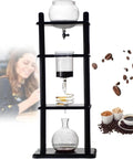 Next Level Manual Cold Drip Coffee Maker For Home Baristas Chasing Killer Cold Brew with glass vessel and timber stand.